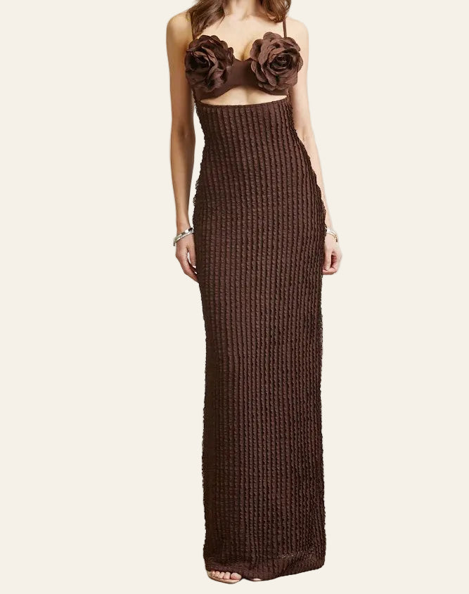 Brown knit dress with floral top on a plain background